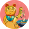 An illustration of a golden beckoning cat with its paw raised, sitting in front of a bowl into which small green pieces are falling, on a pink background. | © SONNENTOR